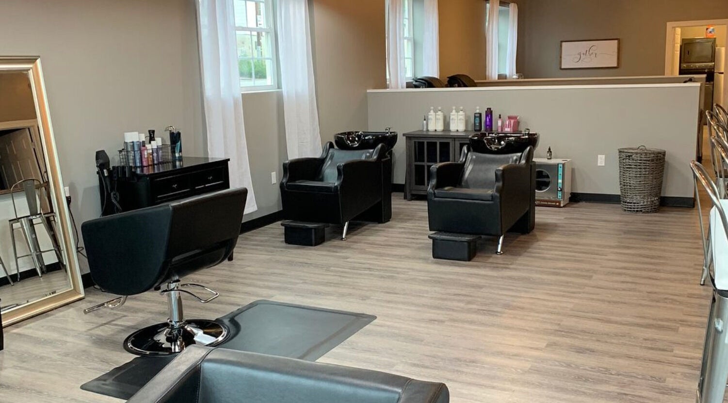 Elegant styling chairs at Stella Salon and Spa in Taylor, Pennsylvania, US, showcasing modern decor and comfort.