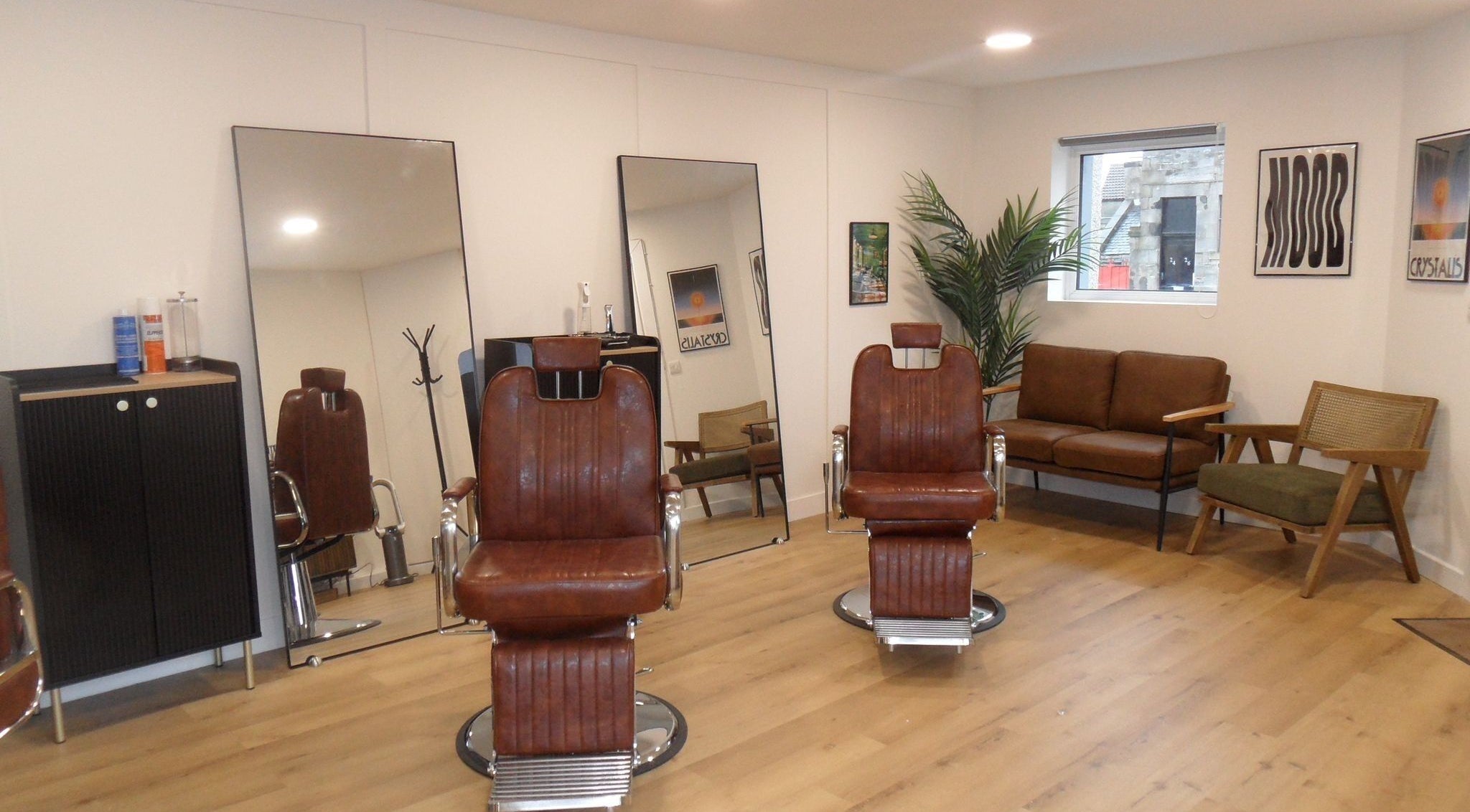 Interior of Mood Barbershop in Kinglassie, Scotland, GB with vintage barber chairs and brown leather seats.