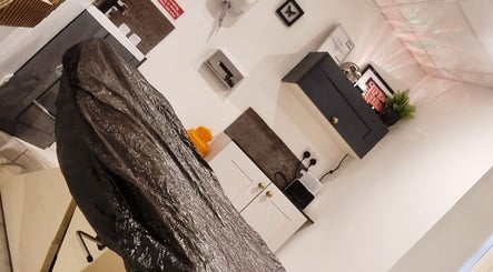 Cozy interior at Sacred Sister Tattoo, Haverfordwest, Wales, GB with a tattoo chair and decor.