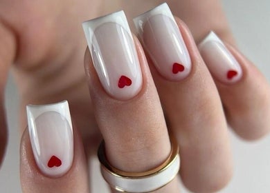 Stylish nail design with red hearts at Moscow Beauty, Riyadh, Riyadh, SA. Chic and modern manicure setting.