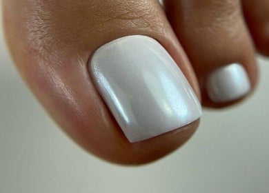Close-up of flawless white pedicure at Moscow Beauty in Riyadh, Riyadh Province, SA.