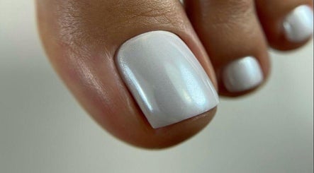 Close-up of flawless white pedicure at Moscow Beauty in Riyadh, Riyadh Province, SA.