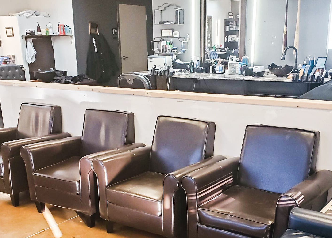 Relaxed seating area inside Joe's: A Barber Shop in Maricopa, Arizona, US, showcasing its inviting atmosphere.
