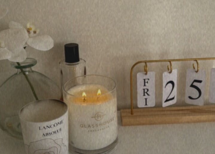 Calming candle and elegant decor at House Of Brows, New Plymouth, Taranaki, NZ enhancing a serene ambiance.