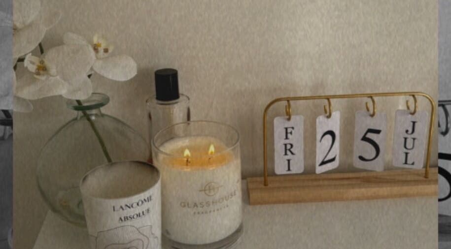 Calming candle and elegant decor at House Of Brows, New Plymouth, Taranaki, NZ enhancing a serene ambiance.