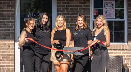 Emily Pendley - Esthetician team at grand opening in West Baden Springs, Indiana, US, cutting a red ribbon.