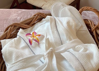 Luxurious robe and slippers with flower at Pure Flow Massage, Bankstown, New South Wales, AU.