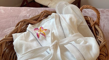 Luxurious robe and slippers with flower at Pure Flow Massage, Bankstown, New South Wales, AU.