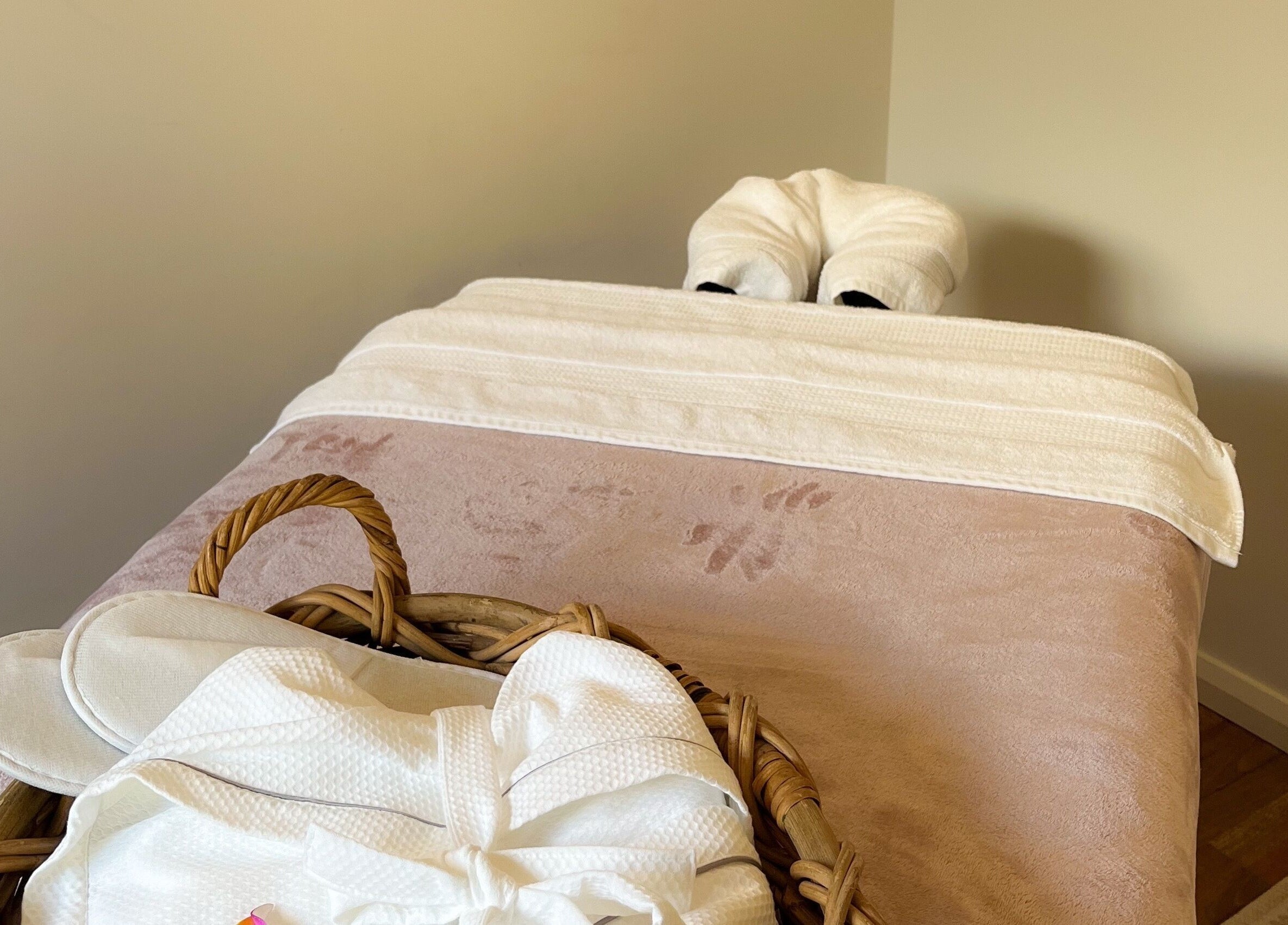 Massage bed with towels at Pure Flow Massage, Bankstown, New South Wales, AU, offering a relaxing ambiance.