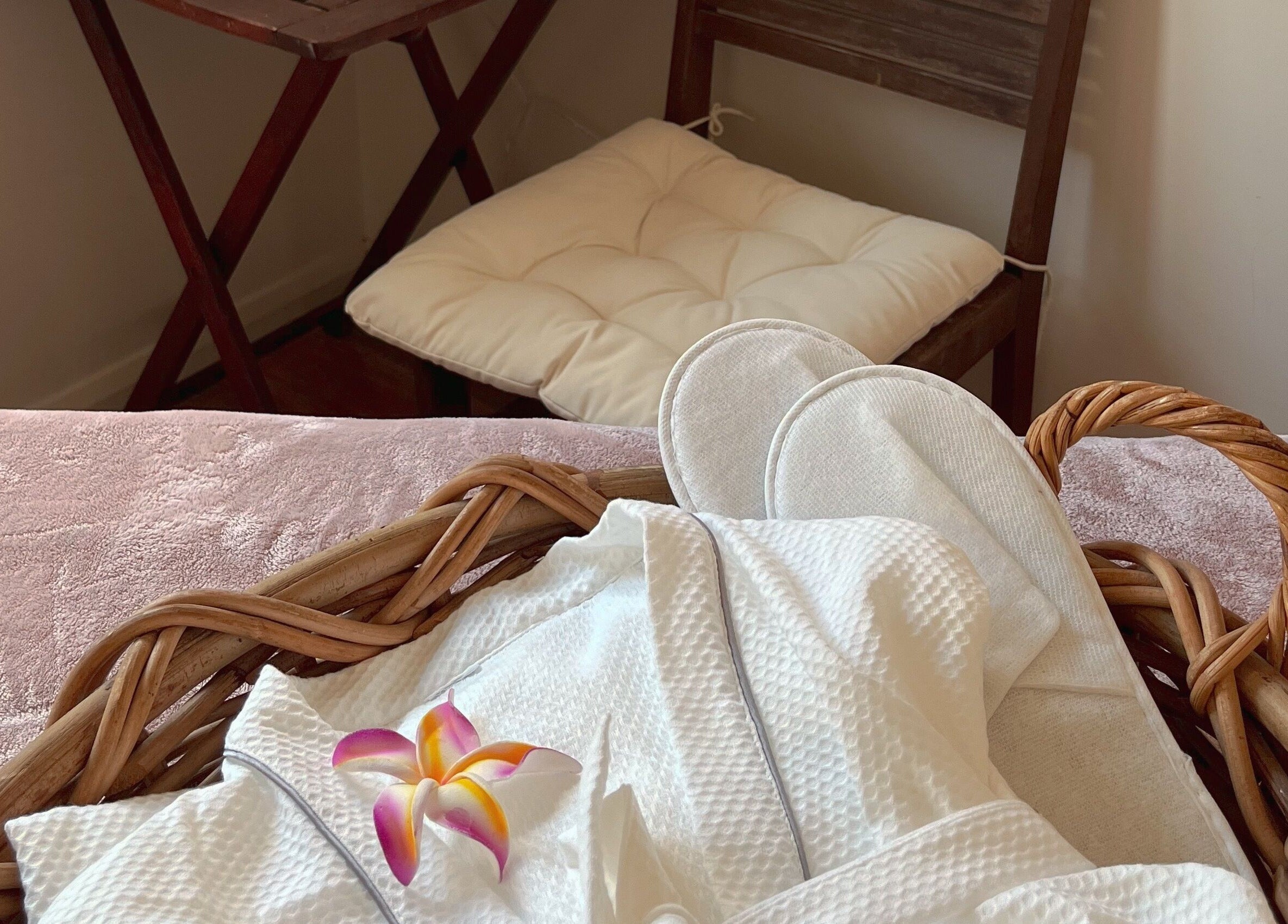 Relaxing spa essentials at Pure Flow Massage, Bankstown, New South Wales, AU, including robe and slippers.