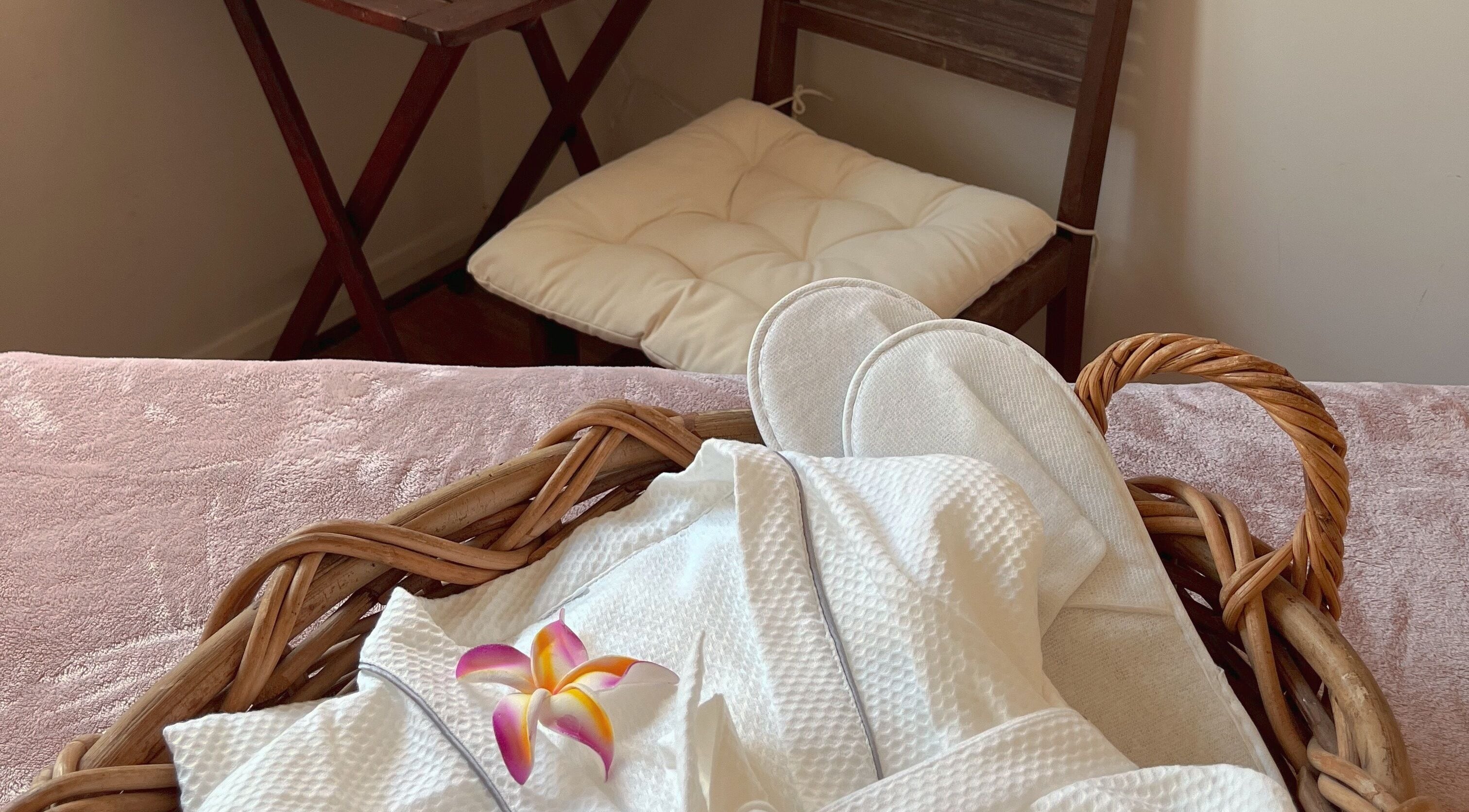 Relaxing spa essentials at Pure Flow Massage, Bankstown, New South Wales, AU, including robe and slippers.