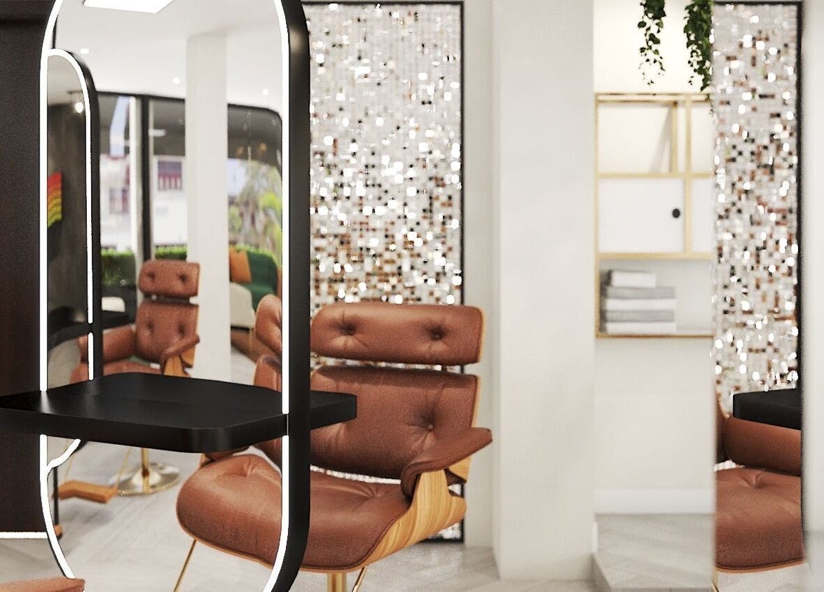 Elegant salon interior at Leena Hari, Colombo, Western Province, LK with stylish seating and modern mirror design.