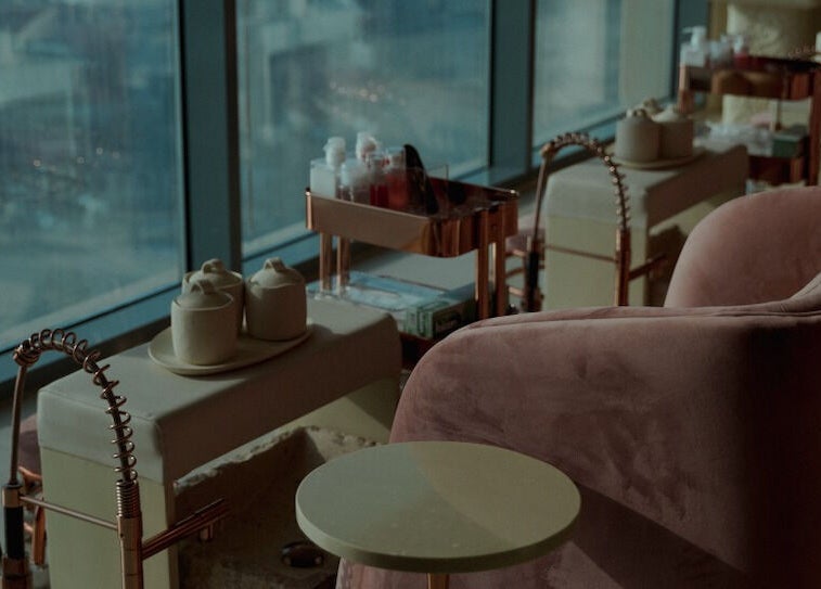 Elegant Nails Salon features plush seating and luxurious decor in Sharjah, Sharjah, AE.