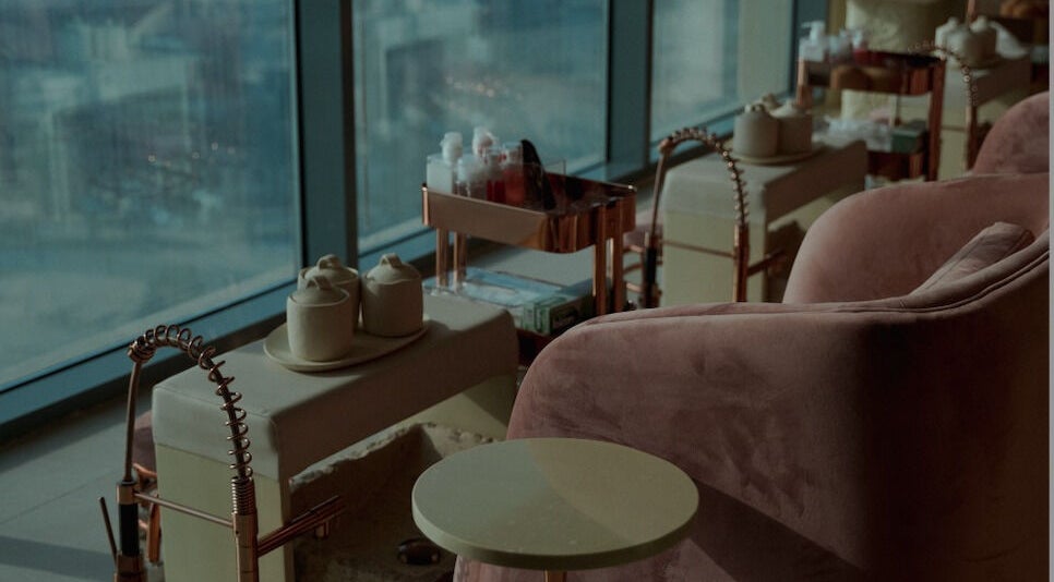 Elegant Nails Salon features plush seating and luxurious decor in Sharjah, Sharjah, AE.