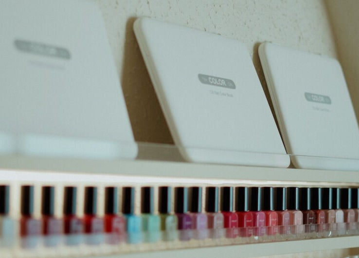 Vibrant nail polish collection at Elegant Nails Salon, Sharjah, Sharjah, AE, showcasing diverse colors.