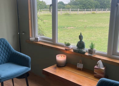 Peaceful therapy room at Massage Therapy with Molly, Hassocks, England, GB, featuring serene decor and green view.