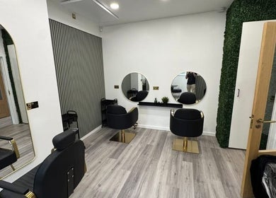 Elegant salon chairs and mirrors at The R.E.H.A.B Limited, Hornchurch, England, GB.