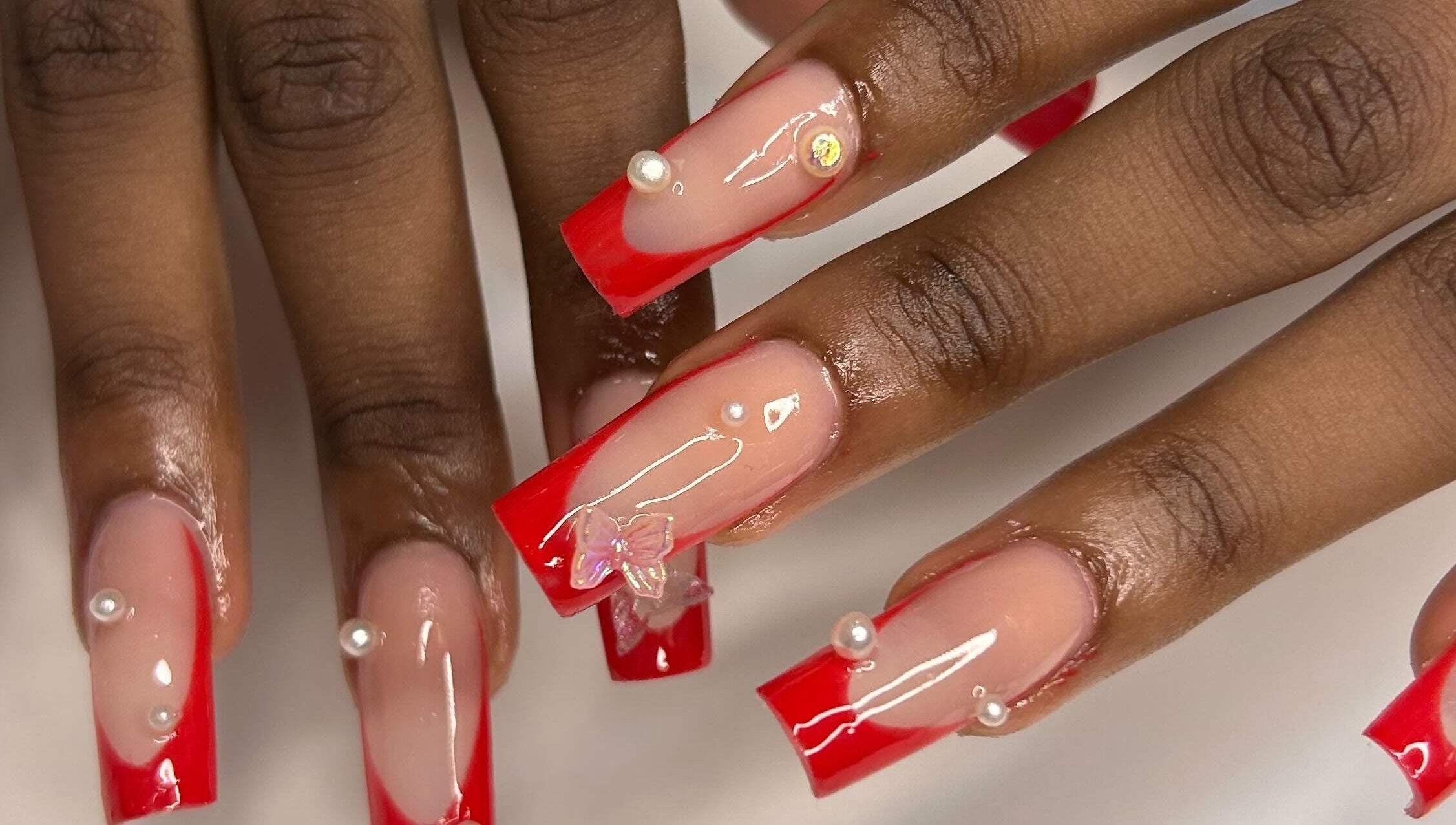 Stunning red and nude nail art with pearls at The Aphentus, Witpoortjie, Gauteng, ZA.
