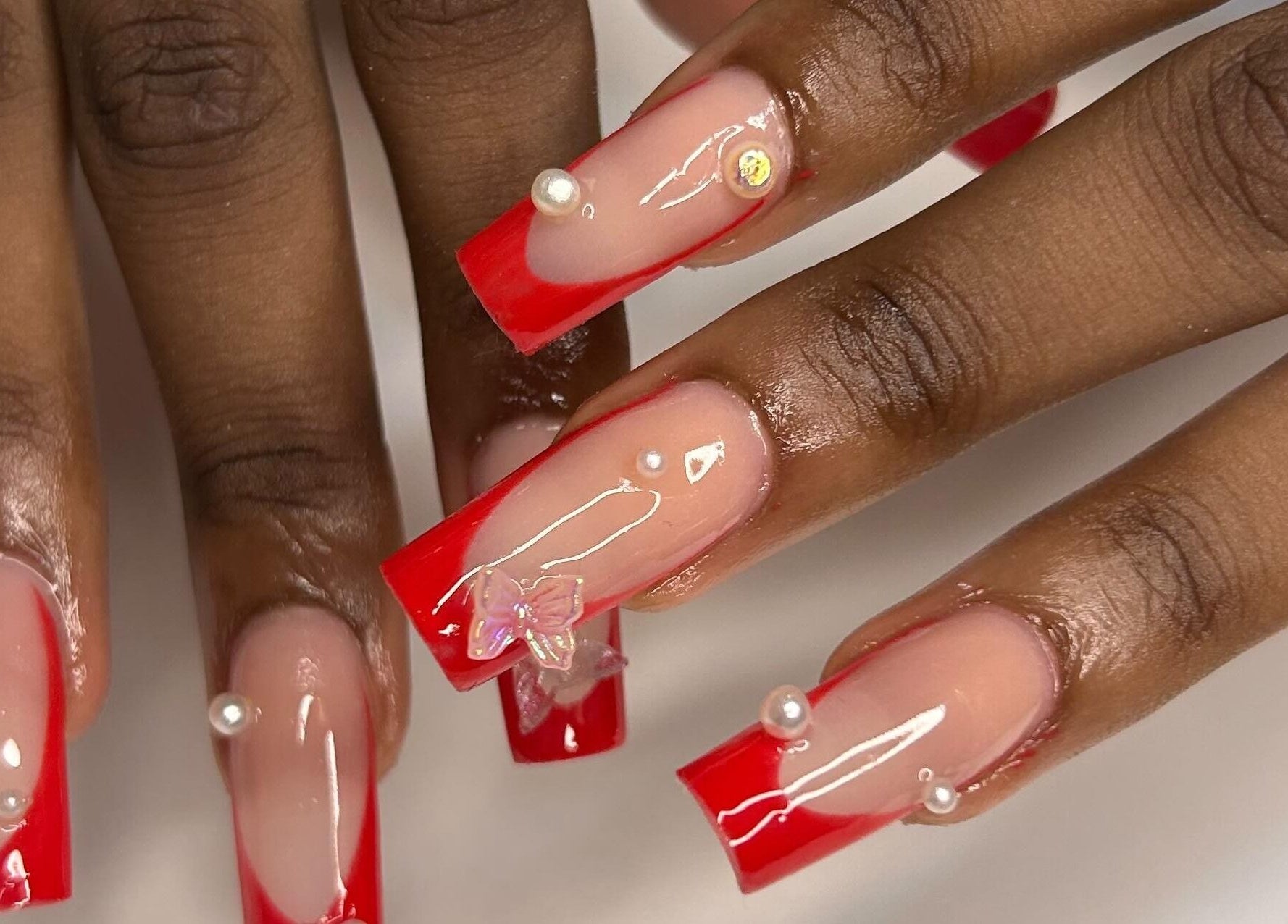 Stunning red and nude nail art with pearls at The Aphentus, Witpoortjie, Gauteng, ZA.