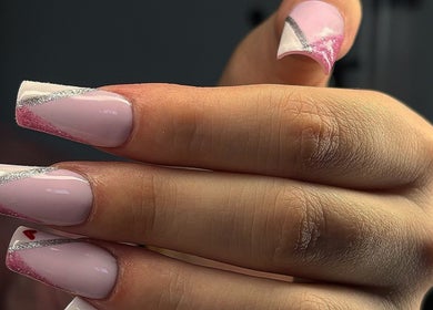 Stylish pink and silver nail art at Ellsbeautymark, Aveley, England, GB, showcasing professional design.