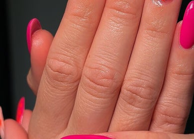 Bright pink nails design at Ellsbeautymark, Aveley, England, GB showcasing vibrant nail art.