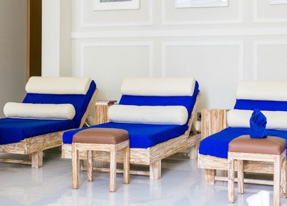 Relaxing blue lounge chairs at Amaya Wellness and Spa, Denpasar, Bali, ID, inviting a soothing retreat.