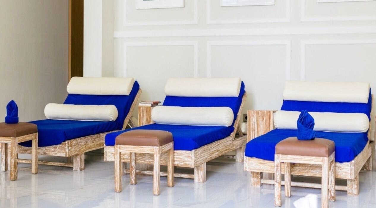 Relaxing blue lounge chairs at Amaya Wellness and Spa, Denpasar, Bali, ID, inviting a soothing retreat.