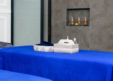 Massage table with blue linen at Amaya Wellness and Spa, Denpasar, Bali, ID. Relax in tranquility.