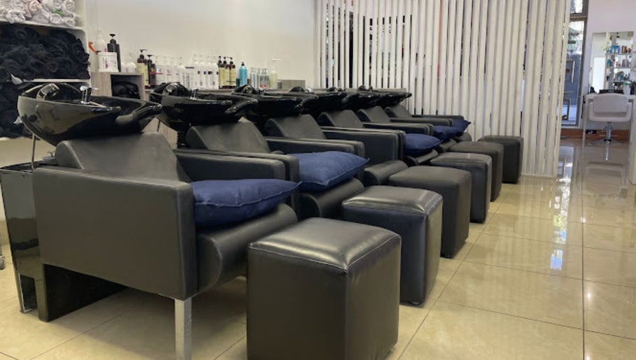 Luxurious shampoo stations at Liz at the Blue Door in Germiston, Gauteng, ZA, featuring sleek design.