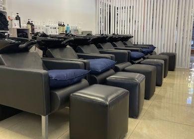 Luxurious shampoo stations at Liz at the Blue Door in Germiston, Gauteng, ZA, featuring sleek design.