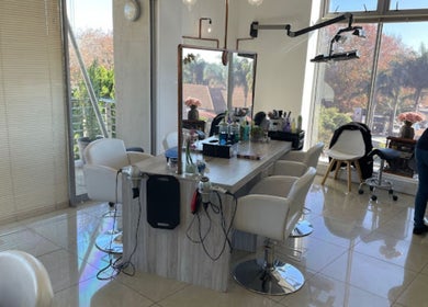 Stylish salon interior at Liz at the Blue Door in Germiston, Gauteng, ZA with modern decor and bright lighting.