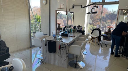 Stylish salon interior at Liz at the Blue Door in Germiston, Gauteng, ZA with modern decor and bright lighting.
