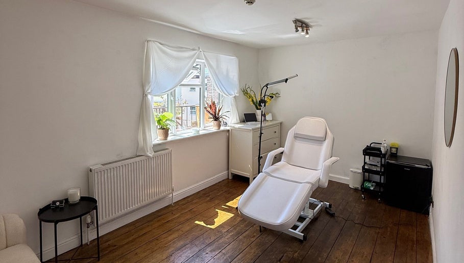 Serene treatment room at Rare Aesthetics UK, Brighton And Hove, GB with comfortable chair and natural light.