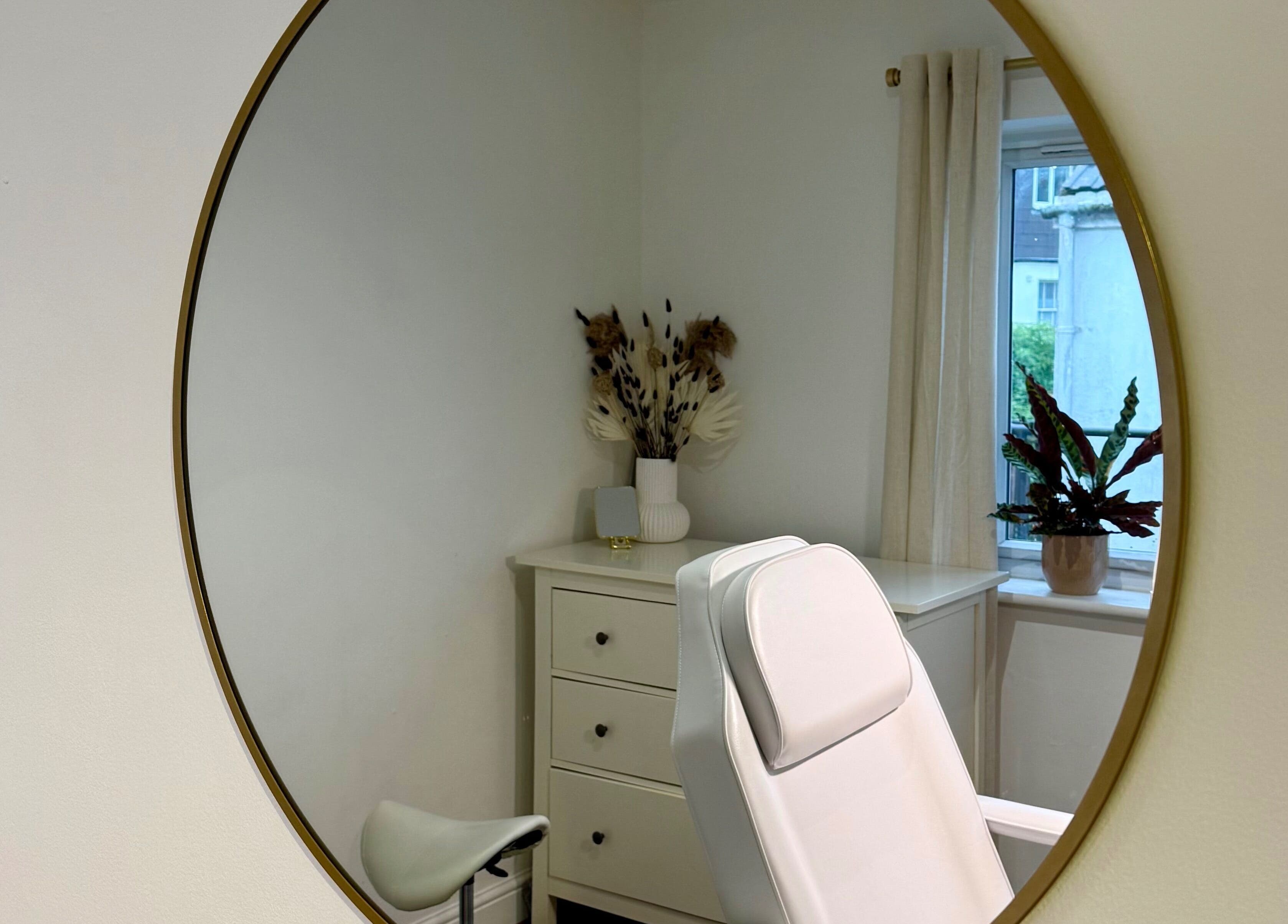 Elegant white treatment chair in a serene room at Rare Aesthetics UK, Brighton And Hove, GB.