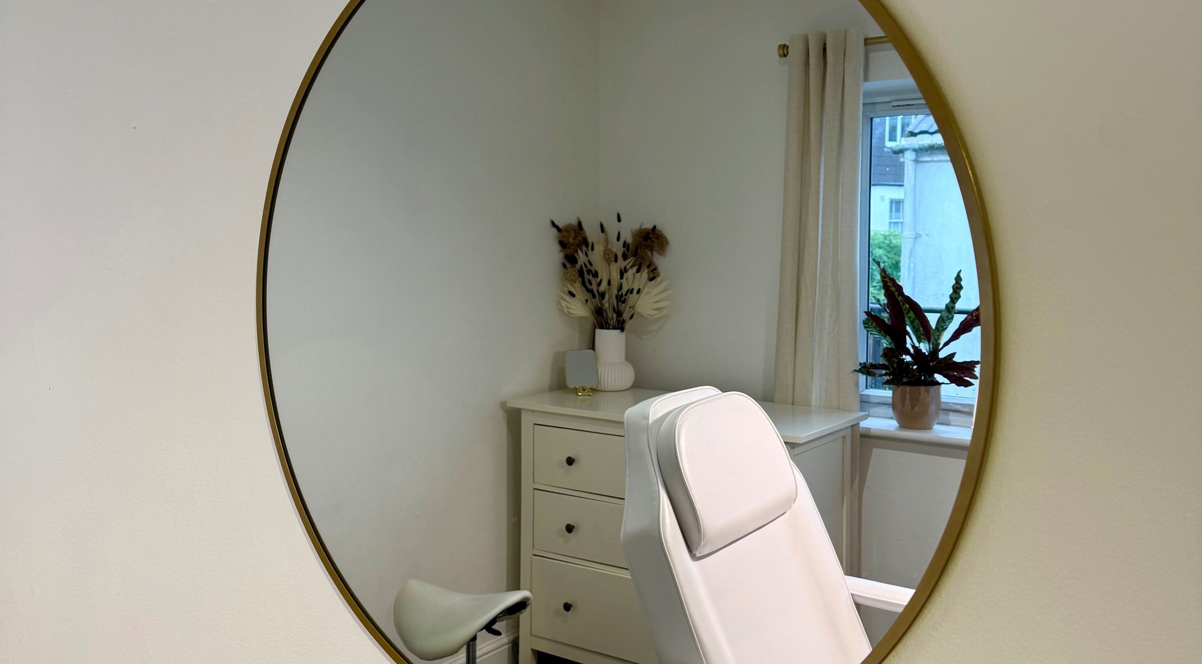 Elegant white treatment chair in a serene room at Rare Aesthetics UK, Brighton And Hove, GB.