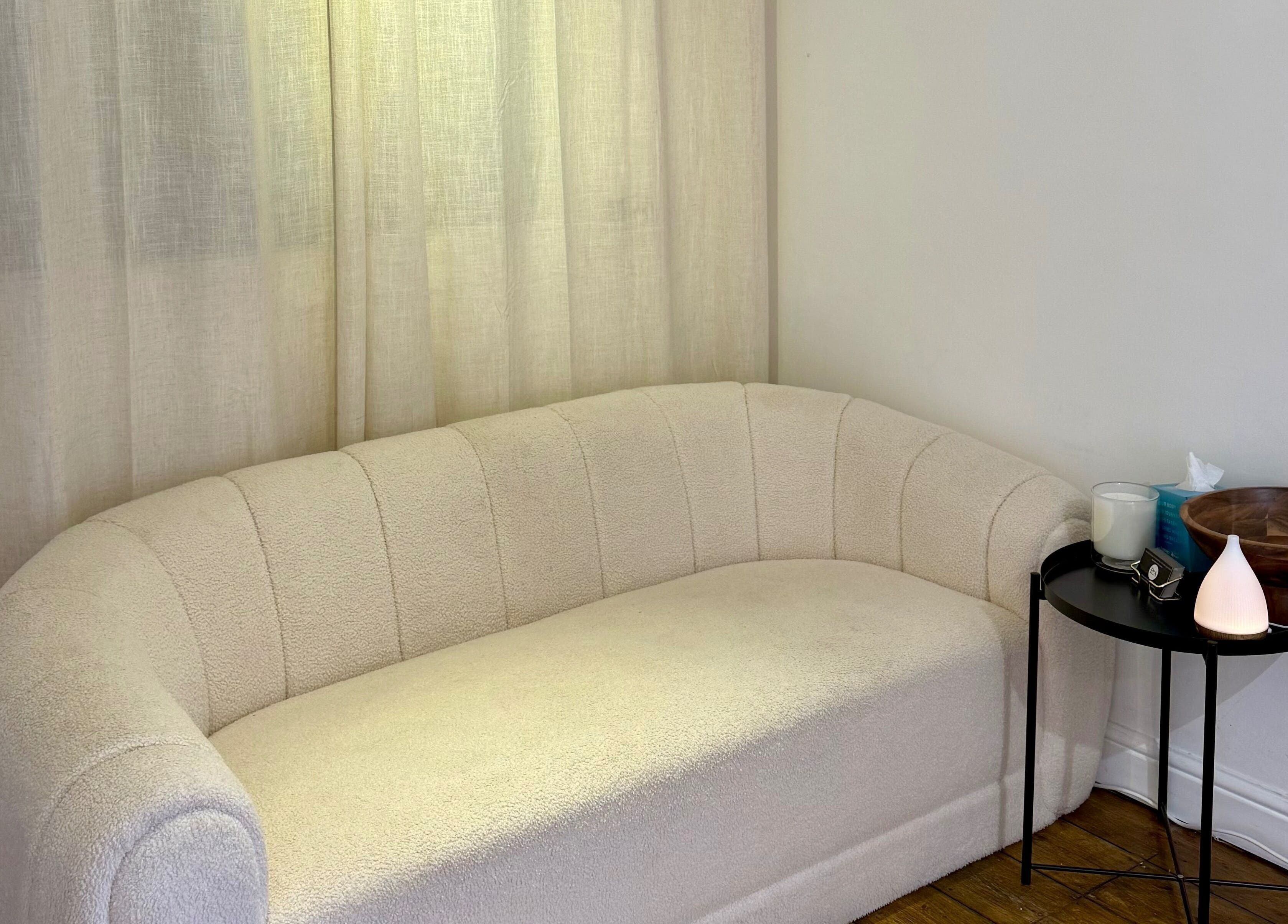 Elegant cream sofa at Rare Aesthetics UK, Brighton And Hove, GB, creating a calming ambience.