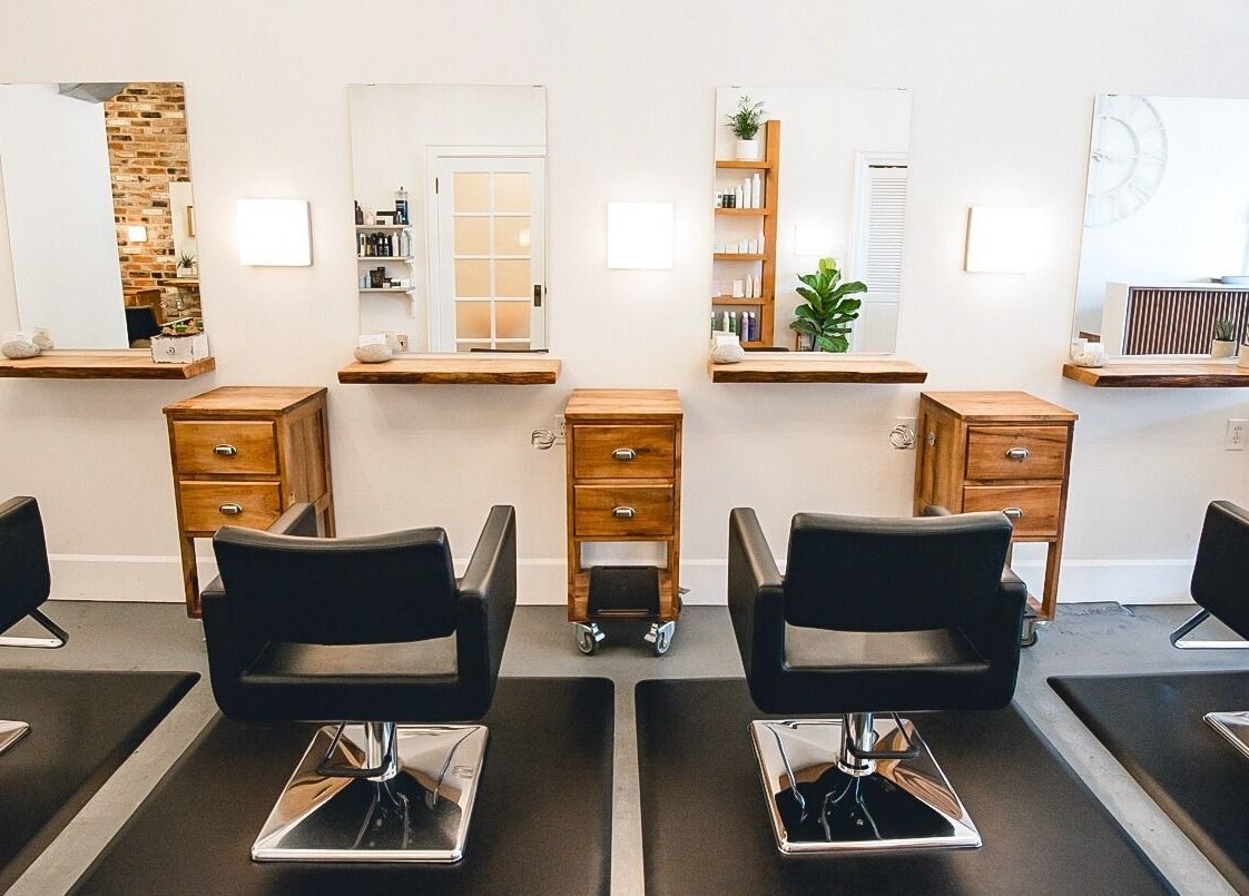 Modern interior of TRiM✂️ Hair Salon + Esthetics, Vancouver, British Columbia, CA, featuring sleek salon chairs.