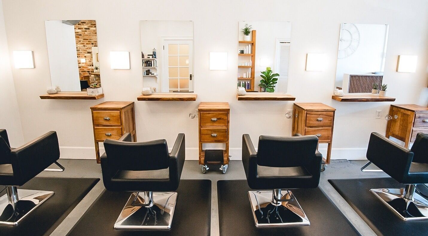 Modern interior of TRiM✂️ Hair Salon + Esthetics, Vancouver, British Columbia, CA, featuring sleek salon chairs.