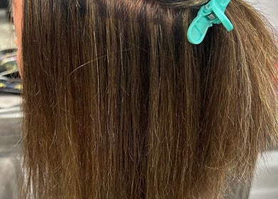 Close-up of sleek hair styling at Georgia Lou Hair, Dewsbury, England, GB.