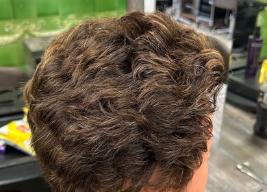 Close-up of styled brown wavy hair at Georgia Lou Hair, Dewsbury, England, GB.