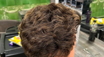 Close-up of styled brown wavy hair at Georgia Lou Hair, Dewsbury, England, GB.