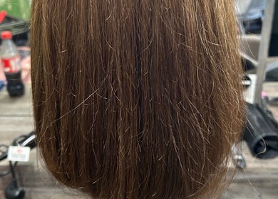 Smooth brown hair styled at Georgia Lou Hair in Dewsbury, England, GB. Optimal shine and professional finish.