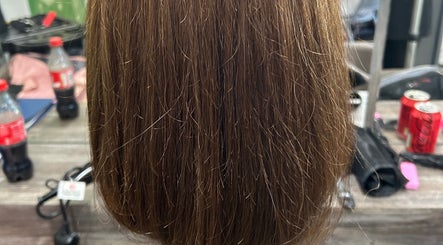 Smooth brown hair styled at Georgia Lou Hair in Dewsbury, England, GB. Optimal shine and professional finish.