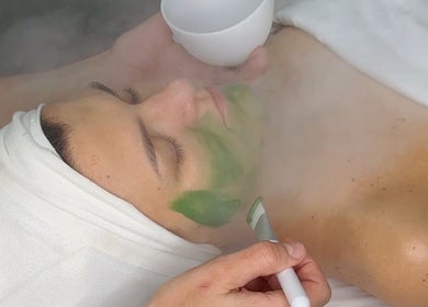 Relaxing facial treatment at A.B. SKINCARE STUDIO, Winnipeg, Manitoba, CA with soothing green mask and steam.