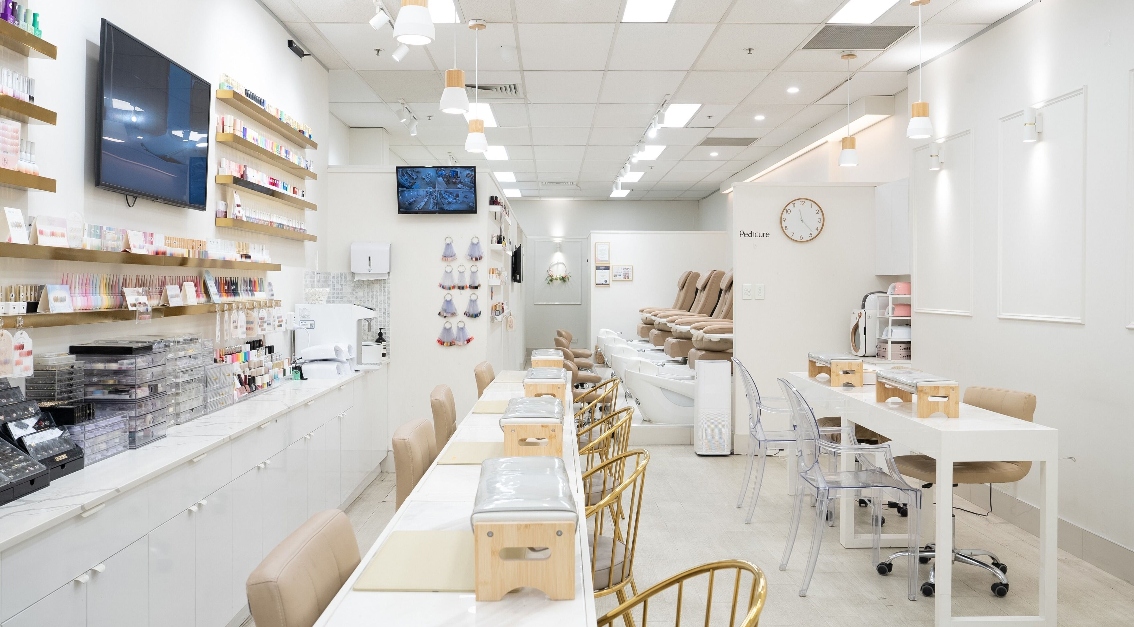 Interior view of Nail Gallery, Sydney, featuring sleek nail stations and pedicure chairs. Sydney, New South Wales, AU.
