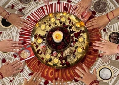 Hands encircle candles and petals at Reiki Readings & Sound - Lou Crangle Psychic Medium, Buderim, Queensland, AU.