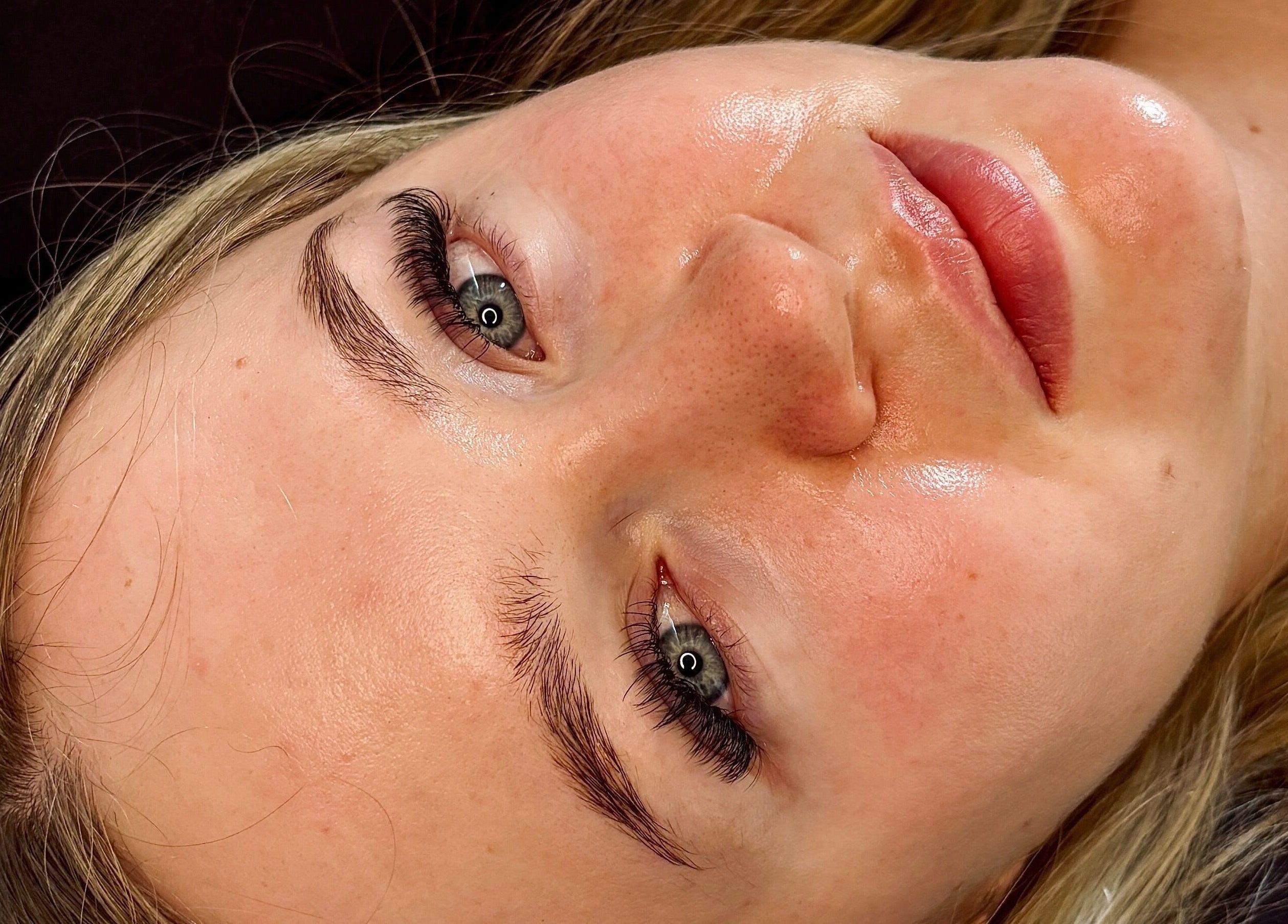 Close-up of a client's glowing skin post-treatment at House Of Gaia, Newmarket, England, GB.