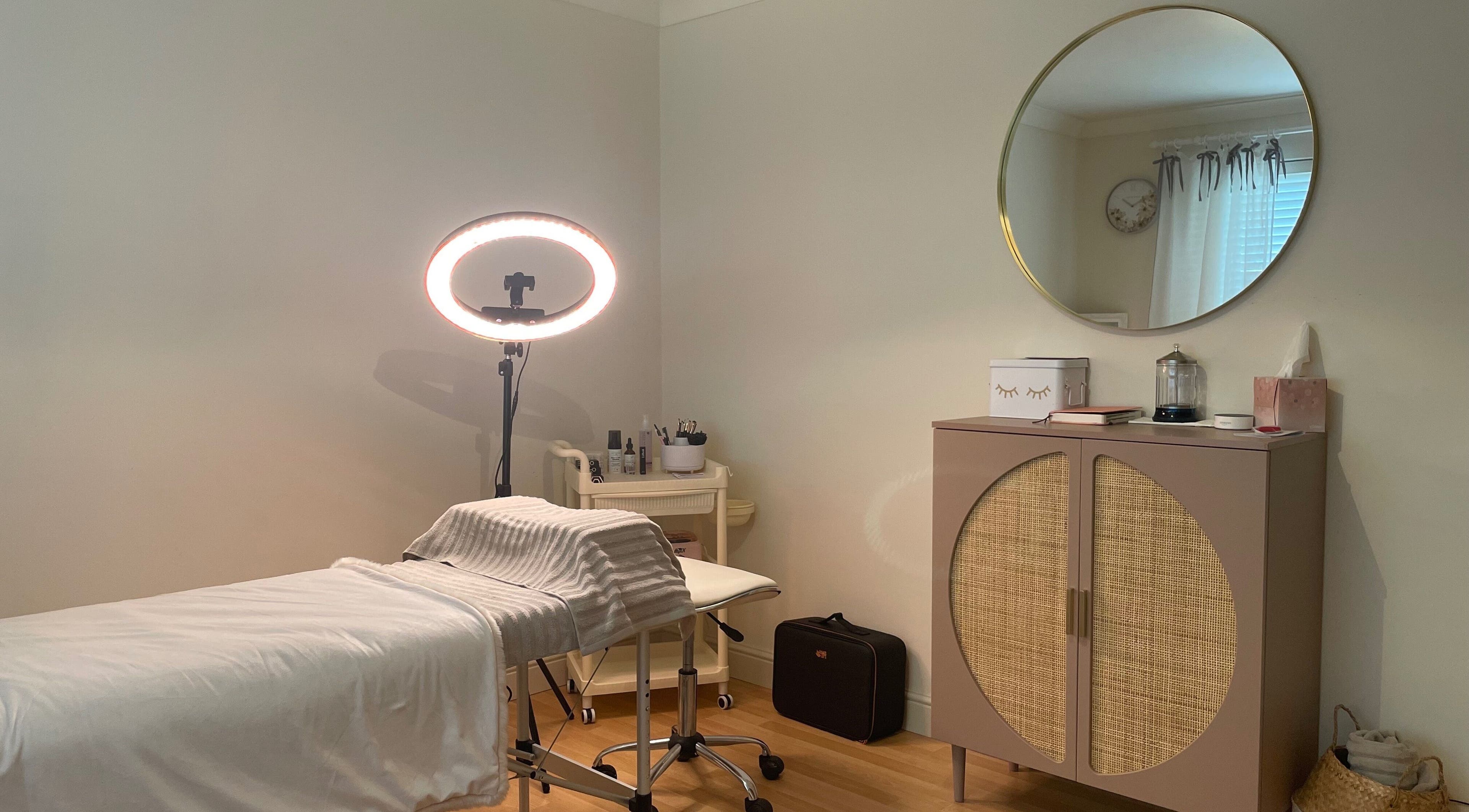 Cozy treatment room at Eyes And Nails By Tamara, Witchford, England, GB, with a treatment bed and stylish decor.