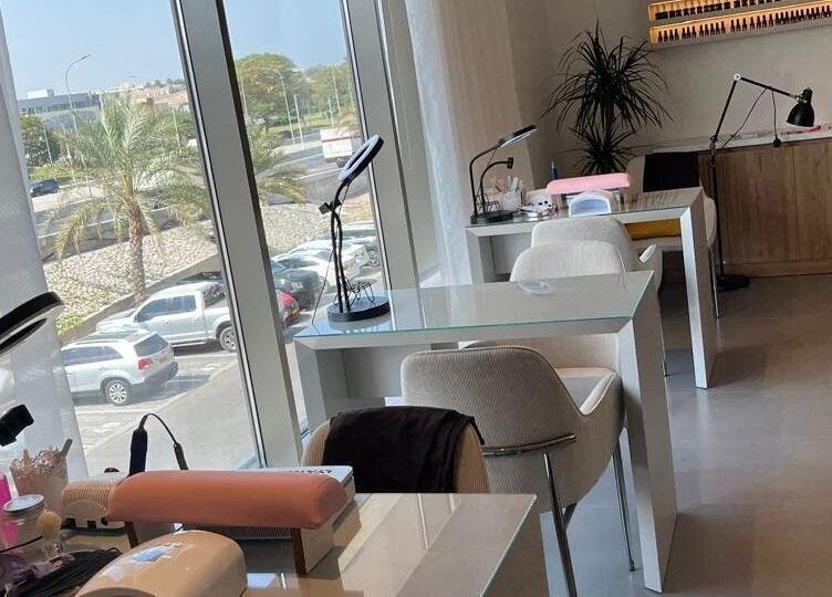Modern nail stations at Rana Beauty Salon, Muscat, Muscat Governorate, OM, with scenic window views.