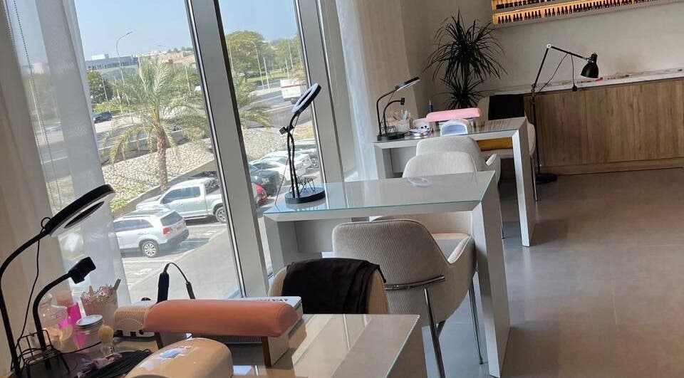 Modern nail stations at Rana Beauty Salon, Muscat, Muscat Governorate, OM, with scenic window views.